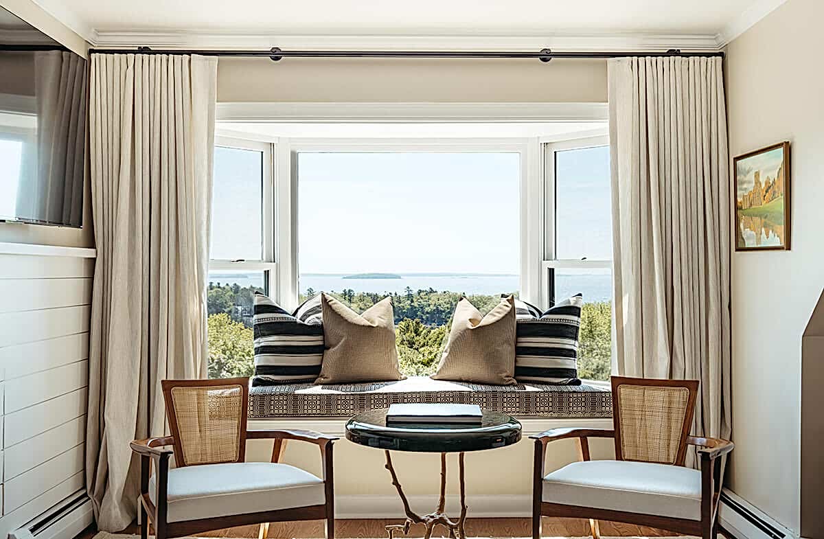 Seating area with water view in penthouse suite