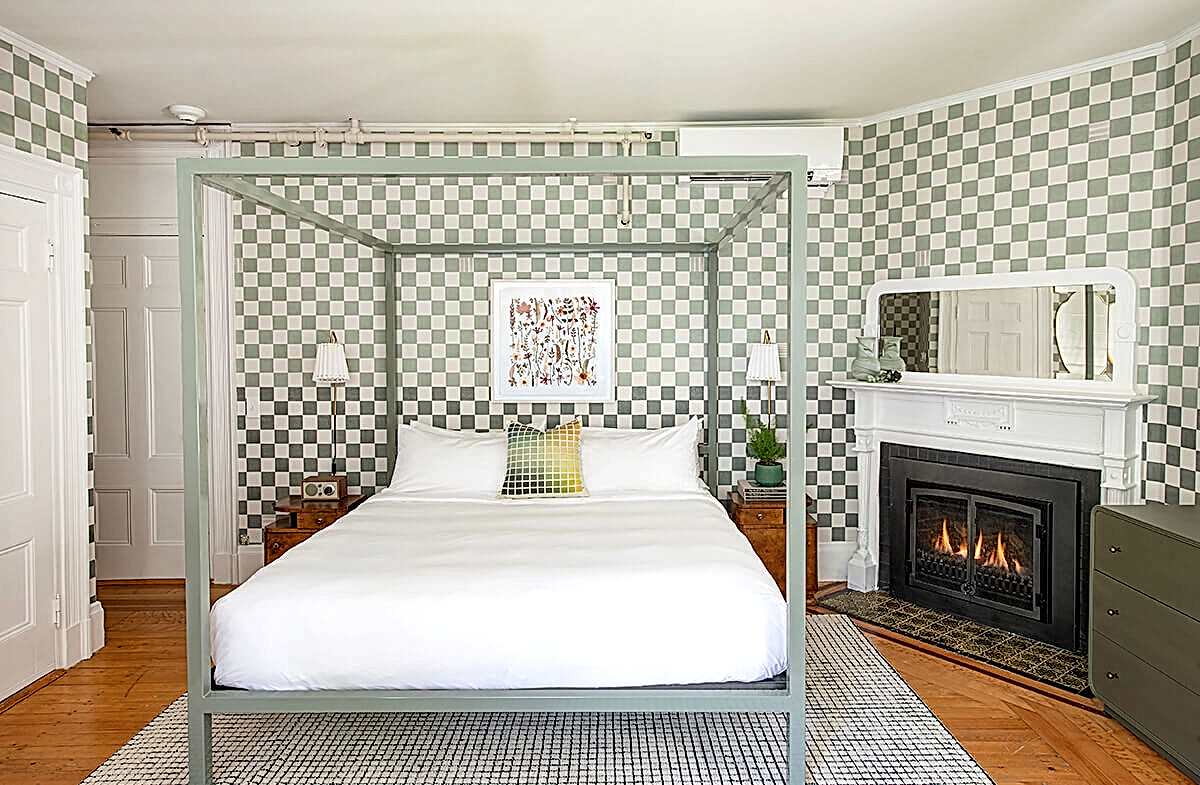 Sandringham guestroom view of bed and fireplace