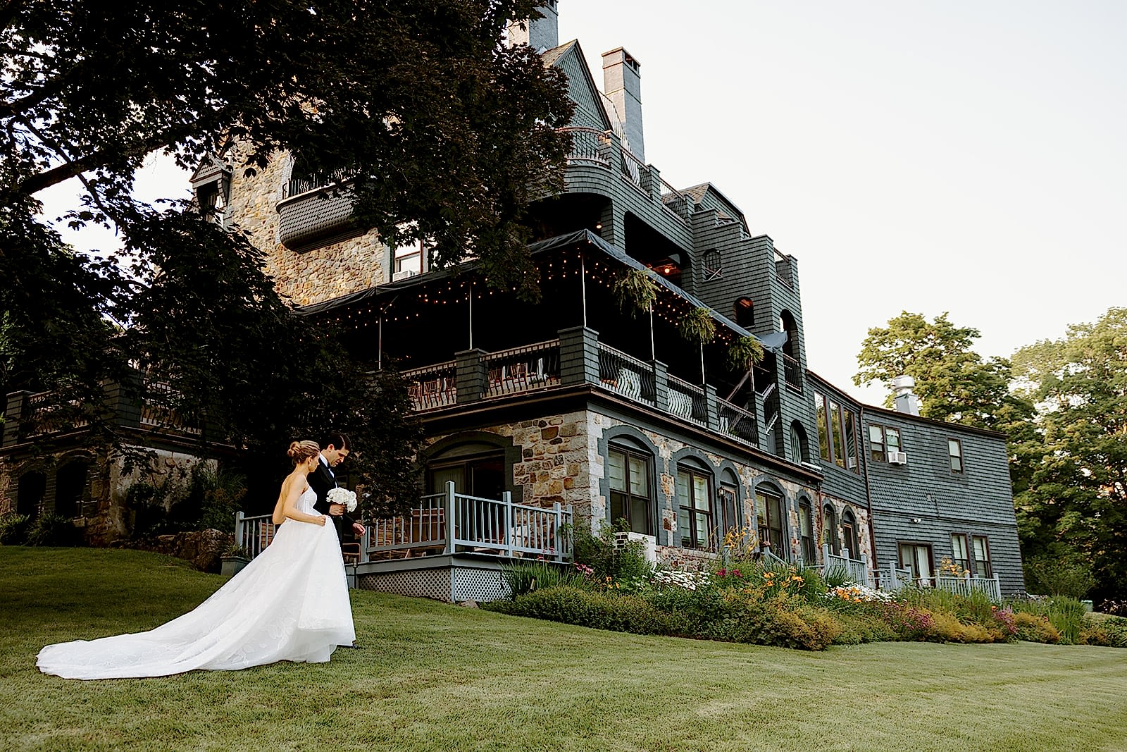 newly married couple walking on lawn
